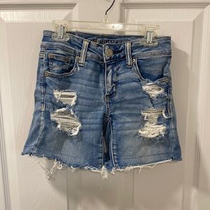 Distressed Midi Jean Shorts With Lace Pocket Accent
